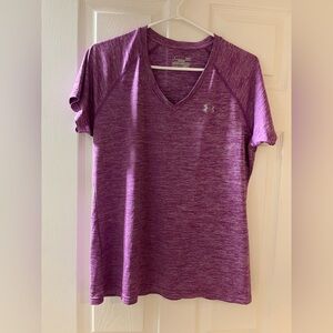 Woman’s pink heathered V neck Under Armour Heat Gear t-shirt.